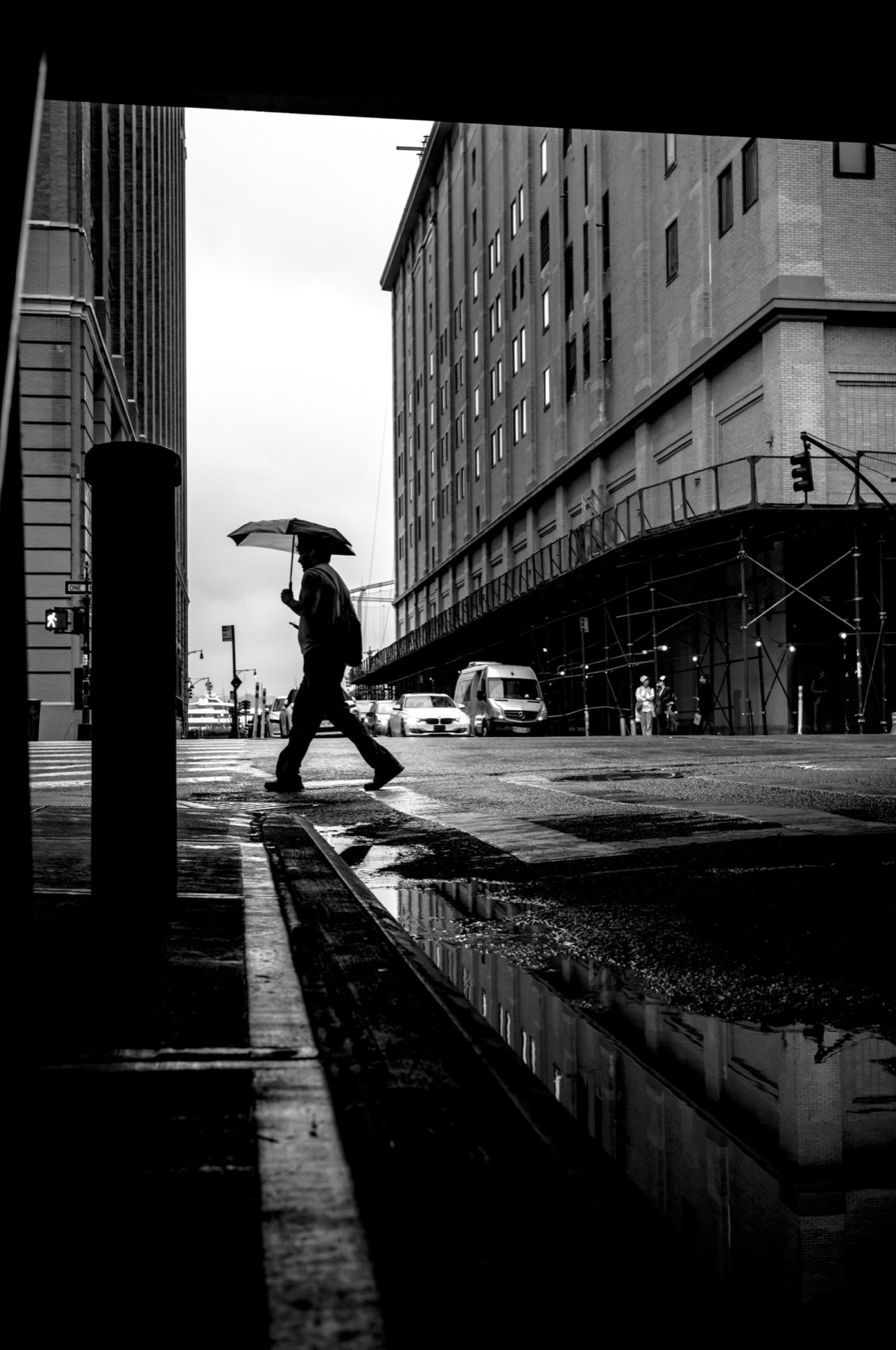Umbrella on the Wet Crossing. New York.